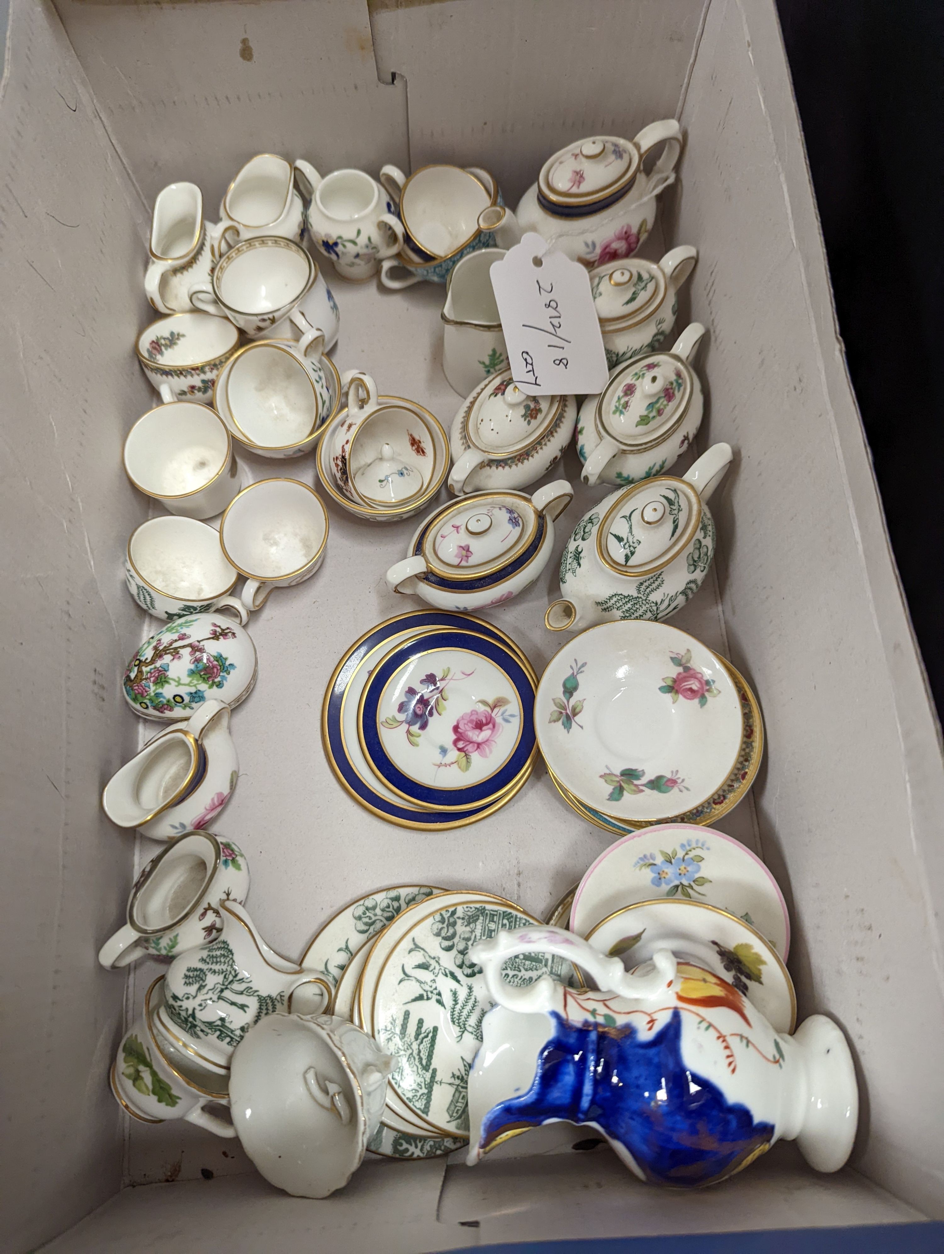 Various miniature Coalport bone china tea sets, a Staffordshire pottery moneybox and other china